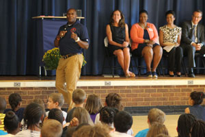 First Lady McAuliffe and Football Coach and Super Bowl Champion Reggie Barlow visit HES