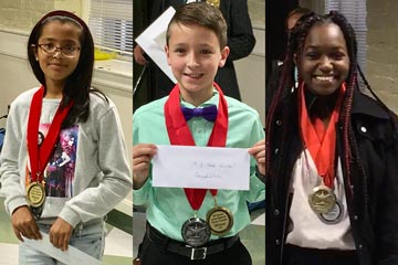 Three contest winners with medals