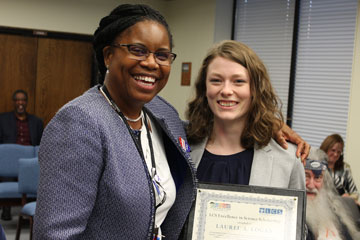 Dr. Edwards and Laurel Logan holding award