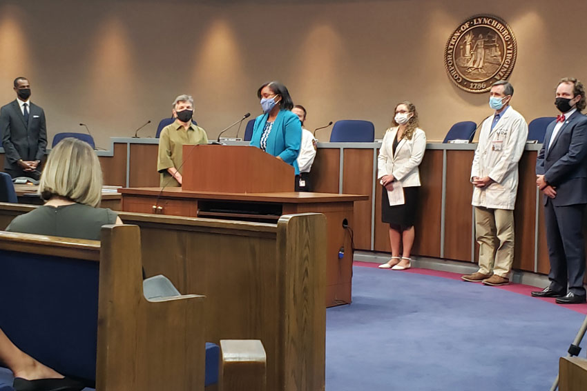 Dr. Edwards speaking at podium