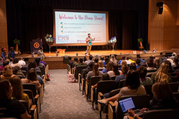 Technology conference attendees in auditorium