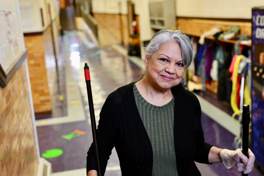 Dora Landa standing in school hallway