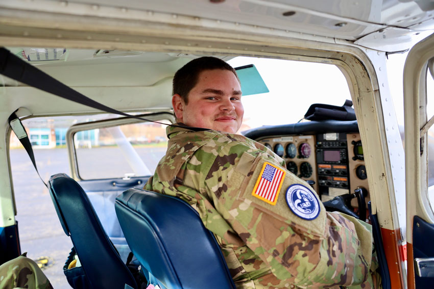 JROTC student sitting in plane