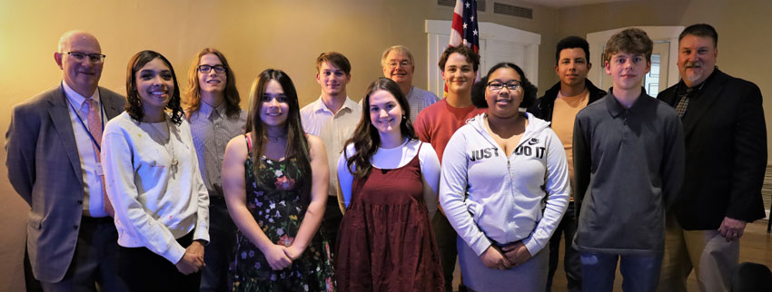 Group of students with Optimist Club members at recognition ceremony