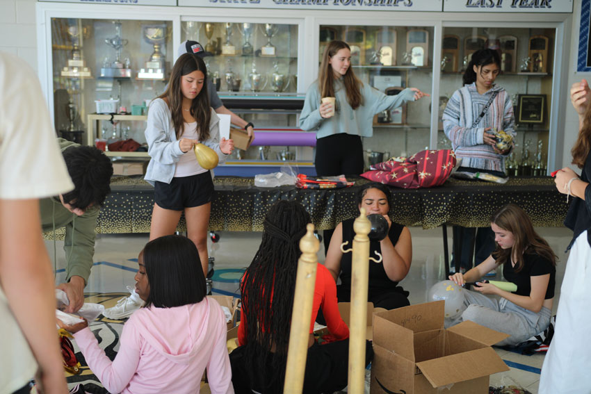 Students creating decorations for Homecoming