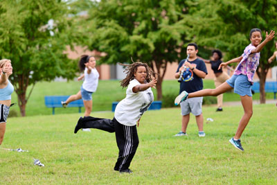 Color guard members practicing choreography