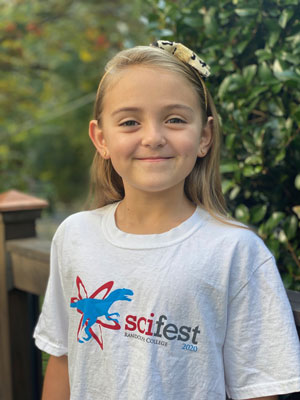 Girls smiling wearing SciFest t-shirt