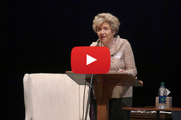 Woman speaking at a podium