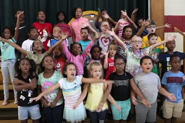 Excited group of students on stage