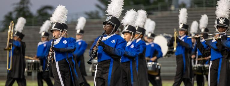 Marching band performing on field